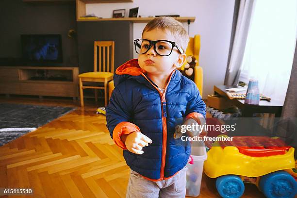 ragazzo divertente - baby eating toy foto e immagini stock