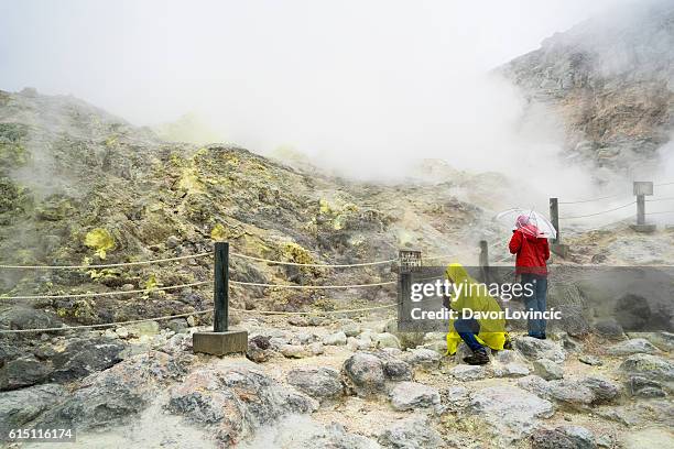 tourists at sulfur mountain iozan on hokkaido, japan - kushiro stock pictures, royalty-free photos & images