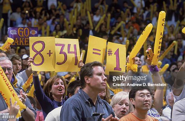 Laker fans relay a message to Bryant and O'Neal in Game 4 of the 2002 NBA Western Conference Finals between the Sacramento Kings and the Los Angeles...