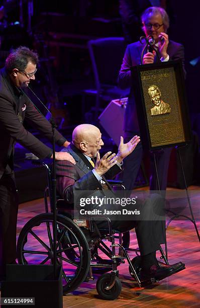 Fred Foster is inducted into the Country Music Hall of Fame by Vince Gill and CMHOF CEO Kyle Young during the 2016 Medallion Ceremony at Country...