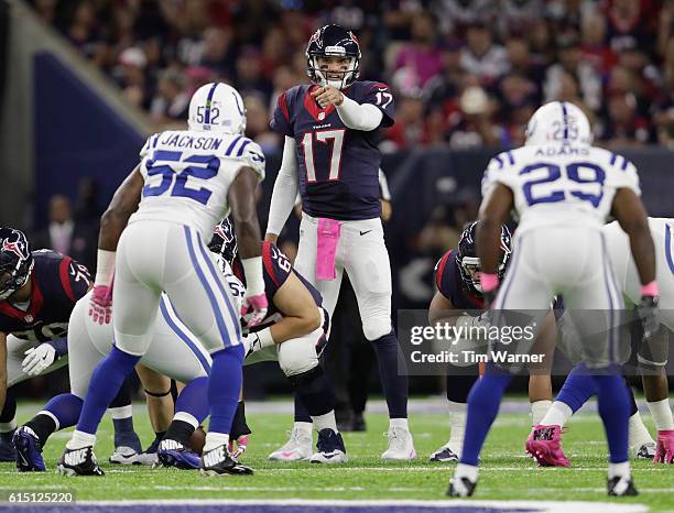 Brock Osweiler of the Houston Texans points at D'Qwell Jackson of the Indianapolis Colts at the line of scrimmage in the fourth quarter at NRG...