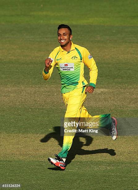 Arjun Nair of CA XI celebrates taking the wicket of Mitchell Marsh of the Warriors during the Matador BBQs One Day Cup match between the Cricket...