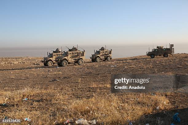 Armored vehicles of the US Army are seen in Bertela region during an operation to retake Iraq's Mosul from Deash in Iraq on October 17, 2016. A much...