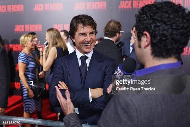 Tom Cruise arrives on the red carpet for "Jack Reacher: Never Go Back" Fan Screening at AMC Elmwood Palace 20 on October 16, 2016 in Harahan,...