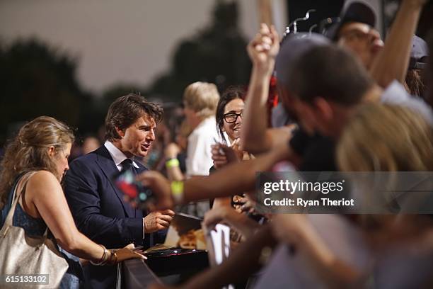 Tom Cruise arrives on the red carpet for "Jack Reacher: Never Go Back" Fan Screening at AMC Elmwood Palace 20 on October 16, 2016 in Harahan,...