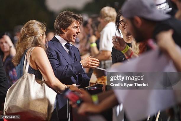 Tom Cruise arrives on the red carpet for "Jack Reacher: Never Go Back" Fan Screening at AMC Elmwood Palace 20 on October 16, 2016 in Harahan,...