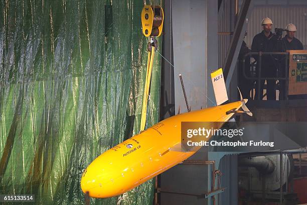An Autosub, autonomous submarine, is winched prior to the keel-laying ceremony of the new polar research ship for Britain, RRS Sir David...