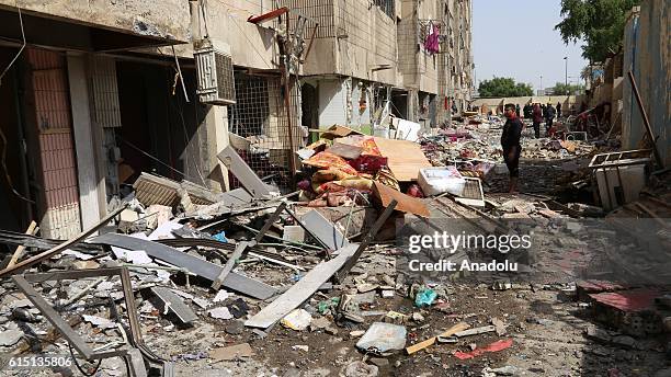 Damaged buildings are seen at the site of a natural gas pipeline explosion at Salihiye neighborhood near Green Zone of Baghdad, Iraq on October 17,...