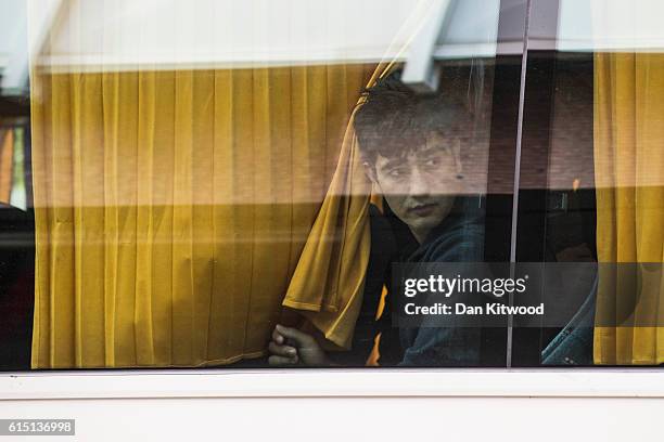 Young boy arrives on a coach at the Home Offices Lunar House after leaving the Calais 'Jungle Camp' on October 17, 2016 in Croydon, England. Fourteen...
