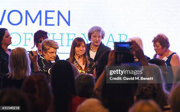 Margaret Aspinall accepts the Special Award on behalf of the Hillsborough Families from British Prime Minister Theresa May at The 61st Women of the...