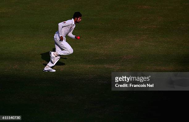 Mohammad Amir of Pakistan bowls during Day Five of the First Test between Pakistan and West Indies at Dubai International Cricket Ground on October...