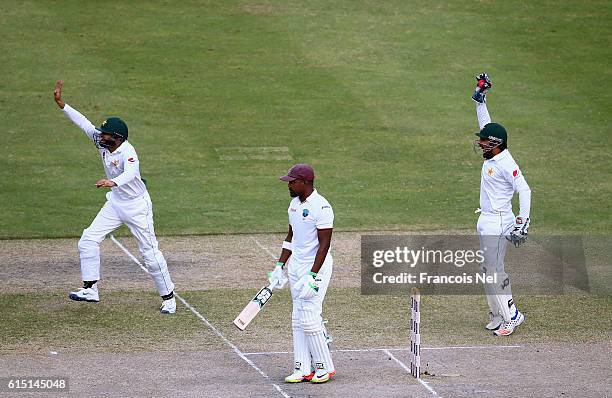 Sarfraz Ahmed and Azhar Ali of Pakistan appeals for the wicket of Darren Bravo of West Indies during Day Five of the First Test between Pakistan and...