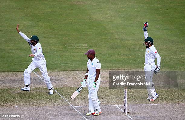 Sarfraz Ahmed and Azhar Ali of Pakistan appeals for the wicket of Darren Bravo of West Indies during Day Five of the First Test between Pakistan and...
