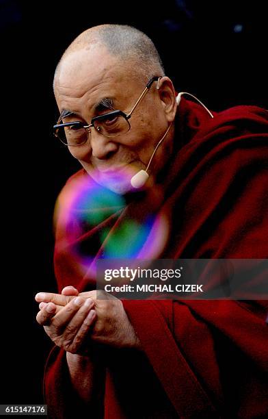Bubble soars past the Tibet's exiled spiritual leader the Dalai Lama prior his speech on Hradcanske square, on October 17, 2016 in Prague. Dalai Lama...