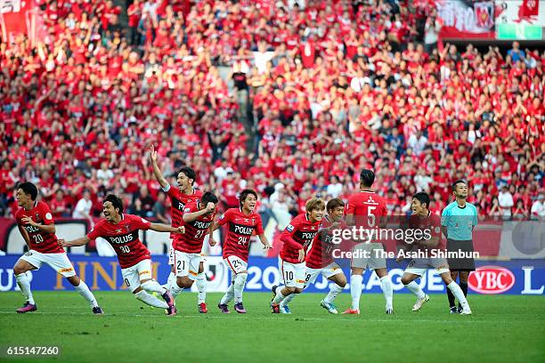 Urawa Red Diamonds players celebrate winning through the penalty shootout during the J.League Levain Cup Final match between Gamba Osaka and Urawa...