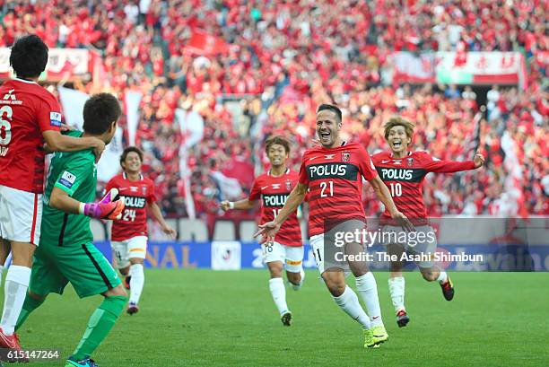 Urawa Red Diamonds players celebrate winning through the penalty shootout during the J.League Levain Cup Final match between Gamba Osaka and Urawa...