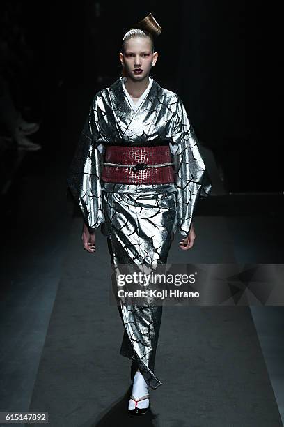 Model showcases designs on the runway during the YOSHIKIMONO show as part of Amazon Fashion Week TOKYO 2017 S/S at Shibuya Hikarie on October 17,...