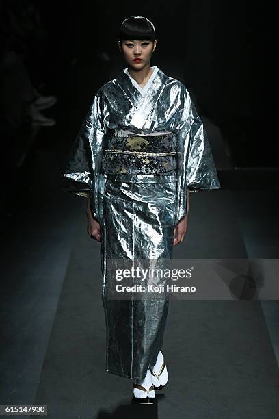 Model showcases designs on the runway during the YOSHIKIMONO show as part of Amazon Fashion Week TOKYO 2017 S/S at Shibuya Hikarie on October 17,...