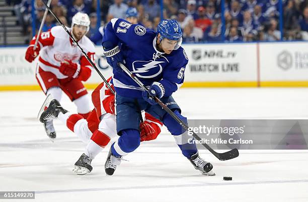 Valtteri Filppula of the Tampa Bay Lightning brings the puck up against Detroit Red Wings during a game at the Amalie Arena on October 13, 2016 in...