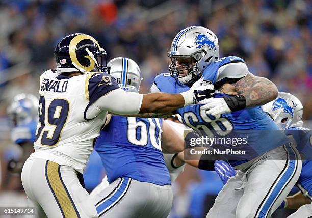 Los Angeles Rams defensive tackle Aaron Donald and Detroit Lions offensive tackle Taylor Decker battle during the second half of an NFL football game...