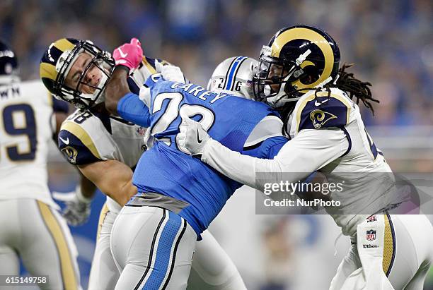 Detroit Lions strong safety Don Carey battles with Los Angeles Rams defensive back Cody Davis , left, and defensive back Marqui Christian during the...