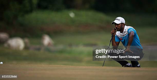 Chikkarangappa S. Of India lines a putt during round four of the 2016 Venetian Macao Open at Macau Golf and Country Club on October 16, 2016 in...
