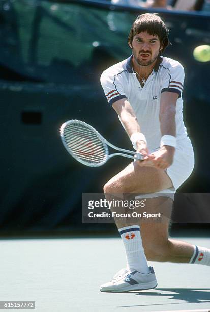 Jimmy Connors of the United States hits a return during the Men's 1980 US Open Tennis Championships circa 1980 at the USTA National Tennis Center in...