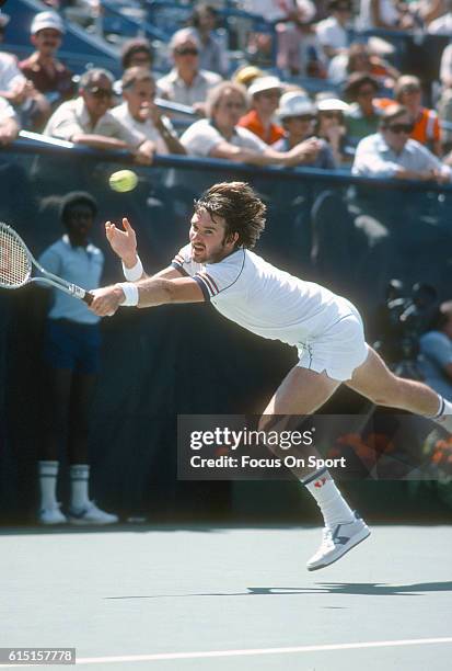 Jimmy Connors of the United States hits a return during the Men's 1980 US Open Tennis Championships circa 1980 at the USTA National Tennis Center in...