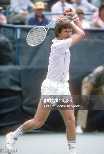 Jimmy Connors of the United States hits a return during a match in the Men's 1983 US Open Tennis Championships circa 1983 at the USTA National Tennis...