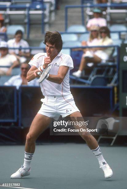 Jimmy Connors of the United States hits a return during a match in the Men's 1983 US Open Tennis Championships circa 1983 at the USTA National Tennis...