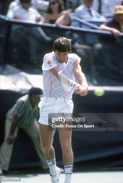 Jimmy Connors of the United States hits a return during a match in the Men's 1983 US Open Tennis Championships circa 1983 at the USTA National Tennis...