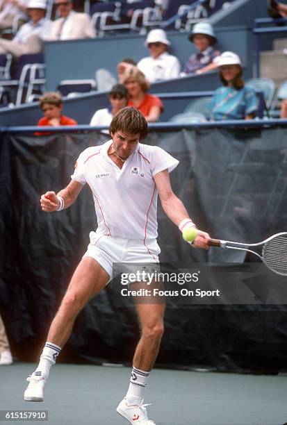 Jimmy Connors of the United States hits a return during a match in the Men's 1983 US Open Tennis Championships circa 1983 at the USTA National Tennis...