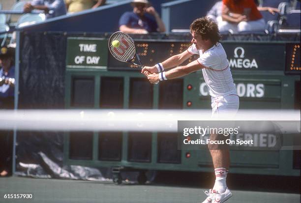 Jimmy Connors of the United States hits a return during a match in the Men's 1983 US Open Tennis Championships circa 1983 at the USTA National Tennis...