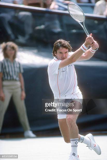 Jimmy Connors of the United States hits a return during a match in the Men's 1983 US Open Tennis Championships circa 1983 at the USTA National Tennis...