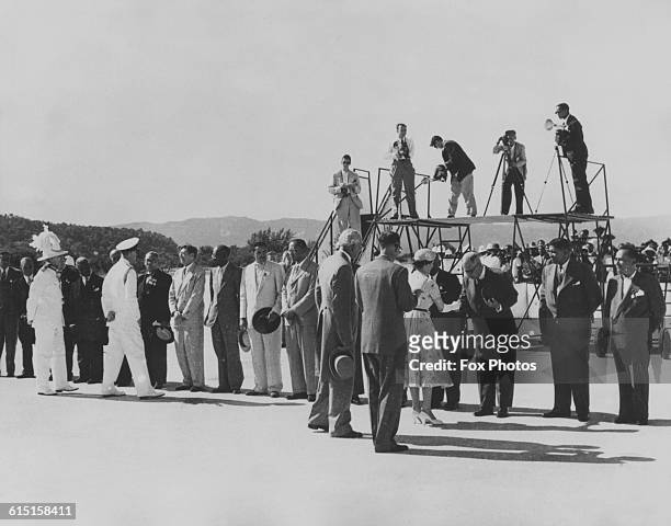 Queen Elizabeth II and Prince Philip, Duke of Edinburgh are introduced to representatives of other West Indian territories by Alexander Bustamante ,...