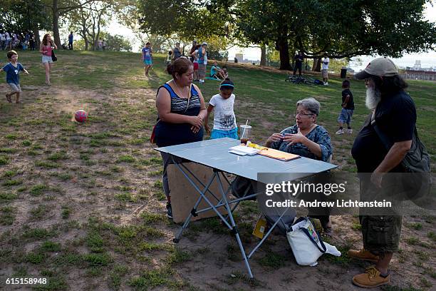Woman registers voters in the heavily immigrant neighborhood of Sunset Park, Brooklyn.