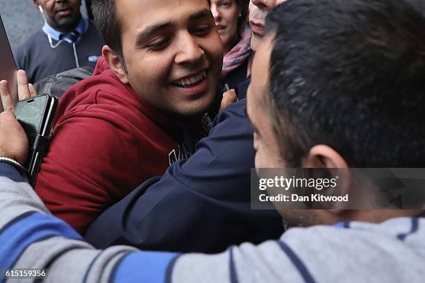 Jan Ghazi, greets his nephew Haris who arrived from in the UK today after leaving the Calais 'Jungle Camp' on October 17, 2016 in Croydon, England....