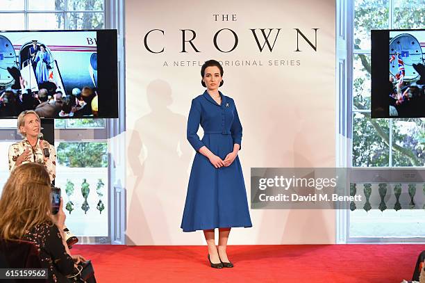 Michele Clapton speaks as a model poses at a presentation featuring costumes from new Netflix Original series "The Crown" with designer Michele...