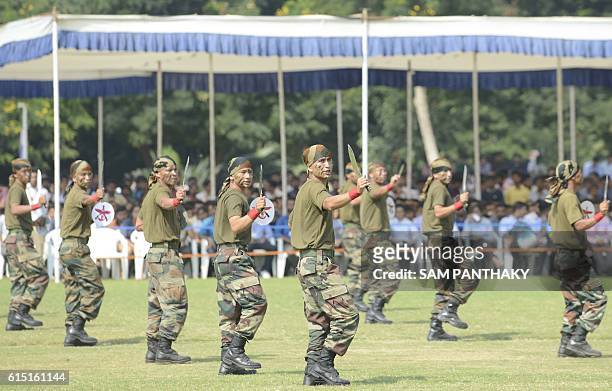 Indian Army soldiers from the Gorkha Regiment perform a 'Khukhri' dance as they participate in a mock display during a 'Know Your Army' event in...