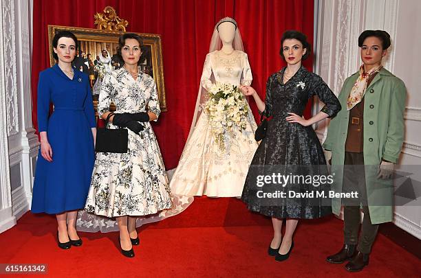 Models pose at a presentation featuring costumes from new Netflix Original series "The Crown" with designer Michele Clapton at the ICA on October 17,...