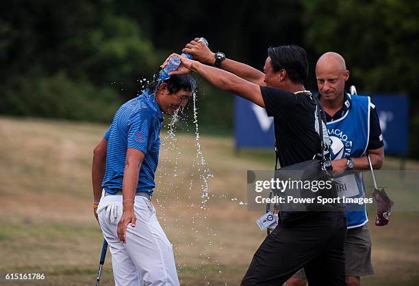 Pavit Tangkamolprasert of Thailand is doused with water as he celebrates after winning the 2016 Venetian Macao Open at Macau Golf and Country Club on...