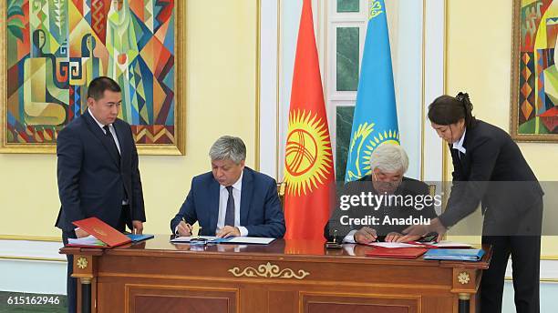 Kazakh Foreign Minister Erlan Idrissov and Kyrgyzstan's Foreign Minister Erlan Abdyldaev sign agreement between Kyrgyzstan and Kazakhstan, in Astana,...
