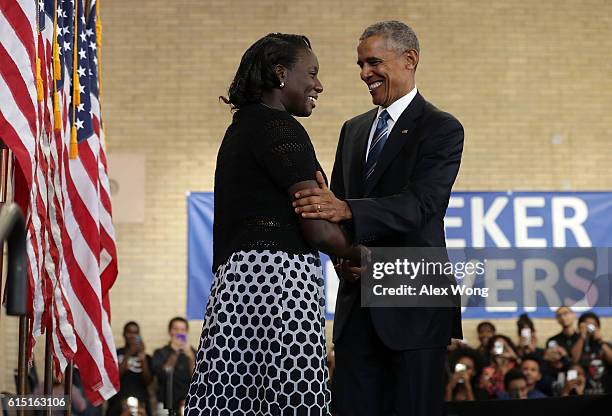 President Barack Obama greets senior Ifunanyachukwu Azikiwe after he was introduced by her during an event at Benjamin Banneker Academic High School...