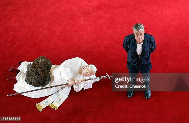 Italian artist Maurizio Cattelan poses next to his artwork "La Nona Ora" prior to the opening of the exhibition "Not Afraid of Love" at the Hotel de...