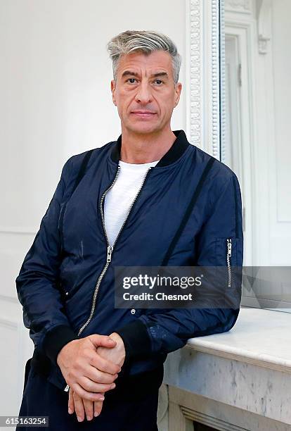 Italian artist Maurizio Cattelan poses prior to the opening of the exhibition "Not Afraid of Love" at the Hotel de la Monnaie on October 17, 2016 in...