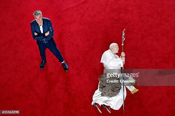 Italian artist Maurizio Cattelan poses next to his artwork "La Nona Ora" prior to the opening of the exhibition "Not Afraid of Love" at the Hotel de...
