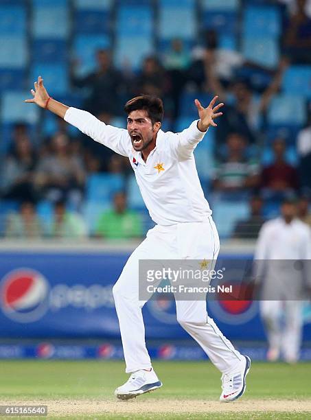 Mohammad Amir of Pakistan reacts during Day Five of the First Test between Pakistan and West Indies at Dubai International Cricket Ground on October...