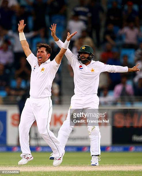 Yasir Shah and Azhar Ali of Pakistan appeals for the wicket of Jason Holder of West Indies during Day Five of the First Test between Pakistan and...