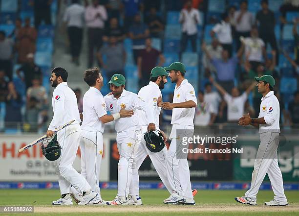 Players of Pakistan celebrates after winning the First Test between Pakistan and West Indies at Dubai International Cricket Ground on October 17,...