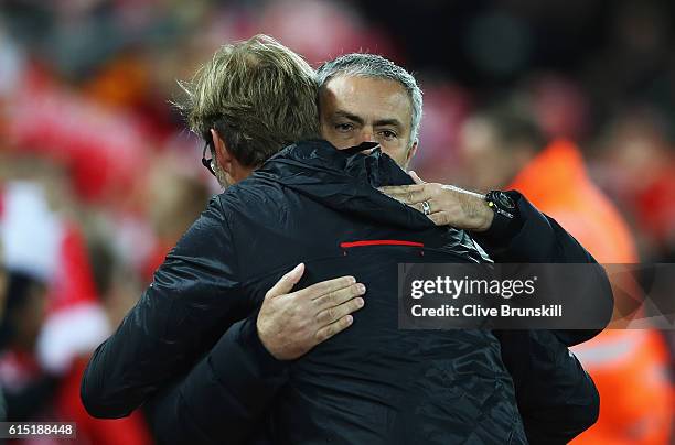 Jose Mourinho, Manager of Manchester United is greeted by Jurgen Klopp, Manager of Liverpool during the Premier League match between Liverpool and...